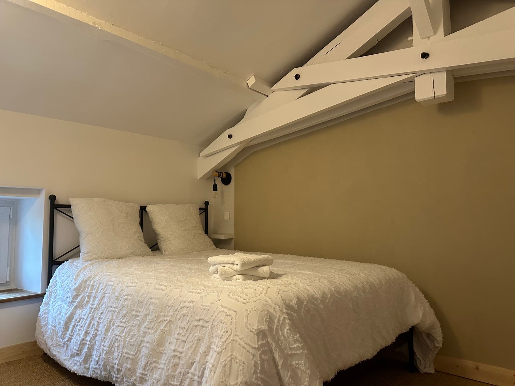 Chambre sous charpente apparente